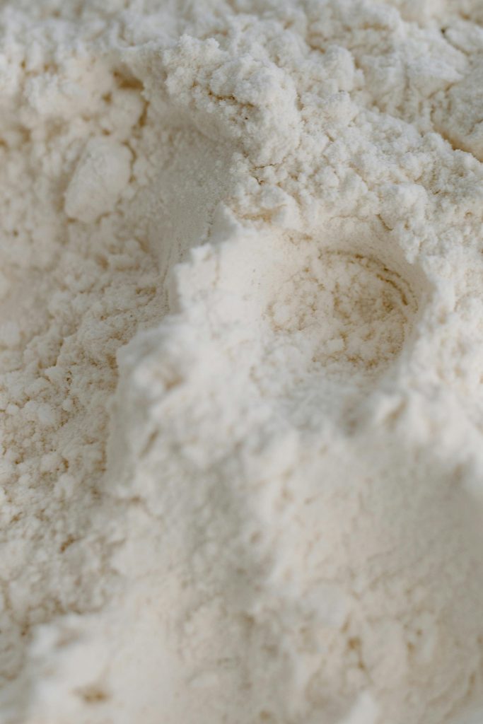 Detailed close-up of white flour with visible texture and powdery appearance.