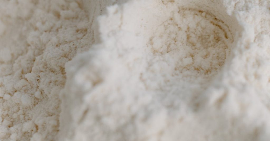 Detailed close-up of white flour with visible texture and powdery appearance.
